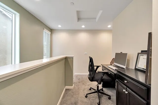 a view of a workspace with furniture