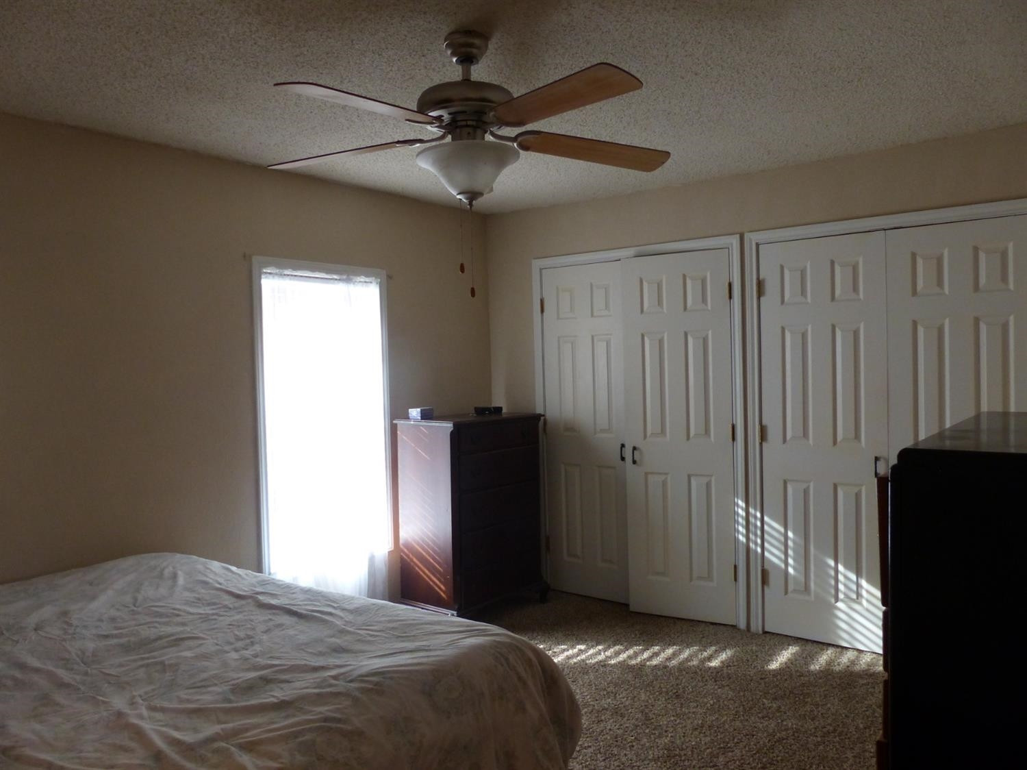 1401 Ave J Abernathy, TX 79311 - Photo 11 of 23 a bedroom with a bed and a ceiling fan