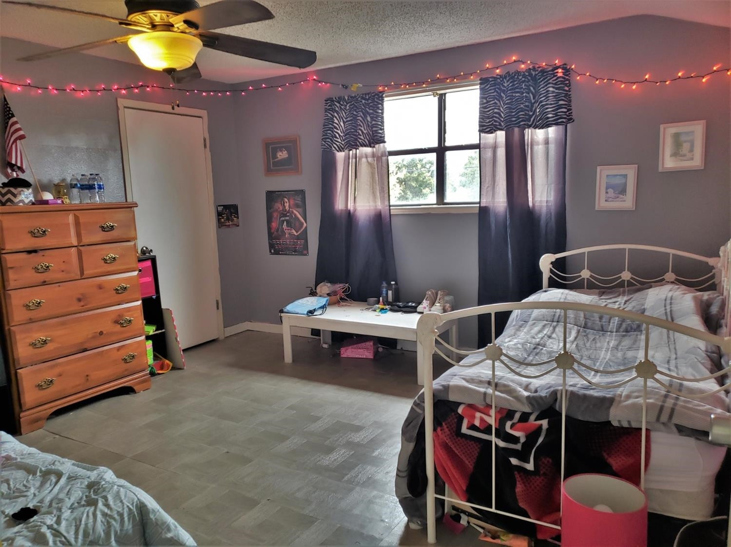 1401 Ave J Abernathy, TX 79311 - Photo 19 of 23 a bedroom with a bed and a chandelier