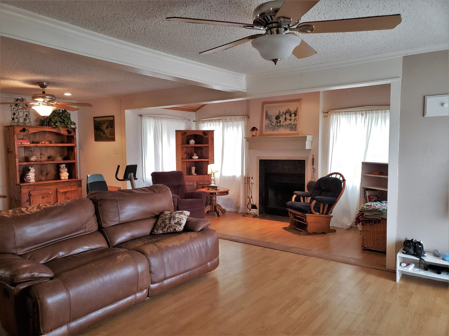 1401 Ave J Abernathy, TX 79311 - Photo 3 of 23 a living room with furniture and a fireplace