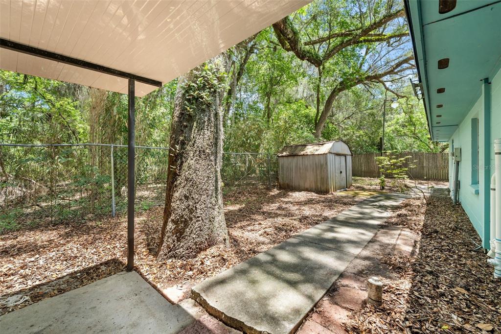 4825 Southwest 19th Street Gainesville, FL 32608 - Photo 26 of 40 a backyard of a house with lots of green space
