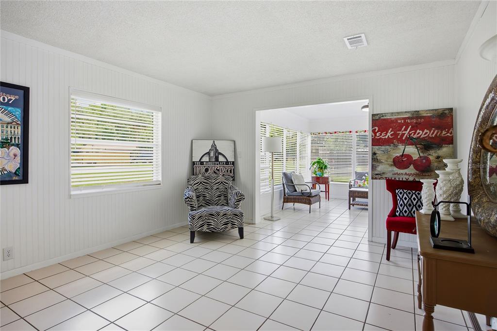 113 Browns Road San Mateo, FL 32187 - Photo 9 of 36 a living room with furniture and a window
