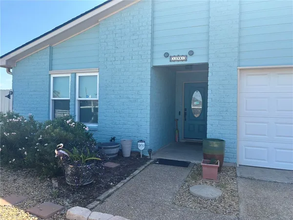 a front view of a house with outdoor space