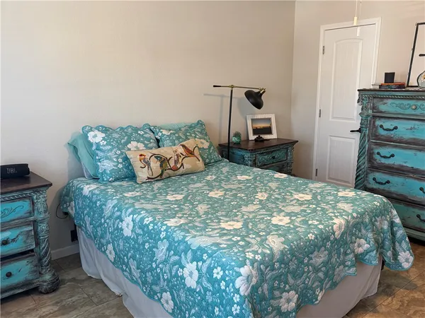 a bedroom with a bed and a dresser