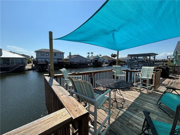 a view of a balcony with furniture