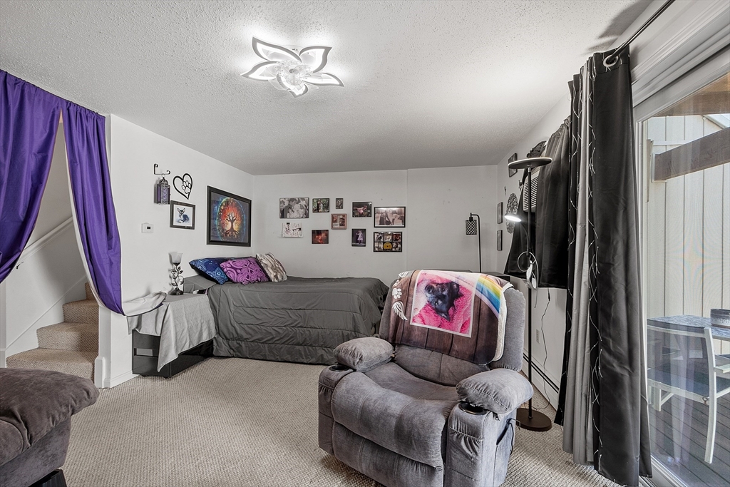 168 Ayer Road, Unit F3 Shirley, MA 01464 - Photo 14 of 36 a living room with furniture and a couch