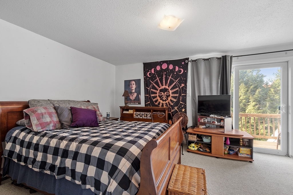 168 Ayer Road, Unit F3 Shirley, MA 01464 - Photo 17 of 36 a bedroom with two beds and a window