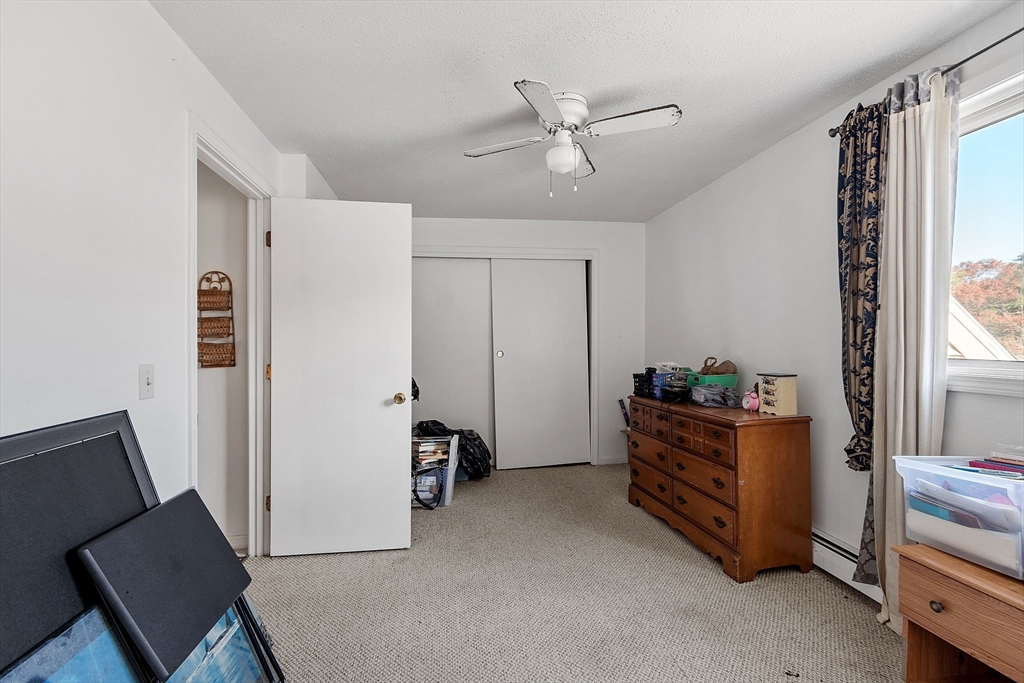 168 Ayer Road, Unit F3 Shirley, MA 01464 - Photo 20 of 36 a room with furniture and white walls