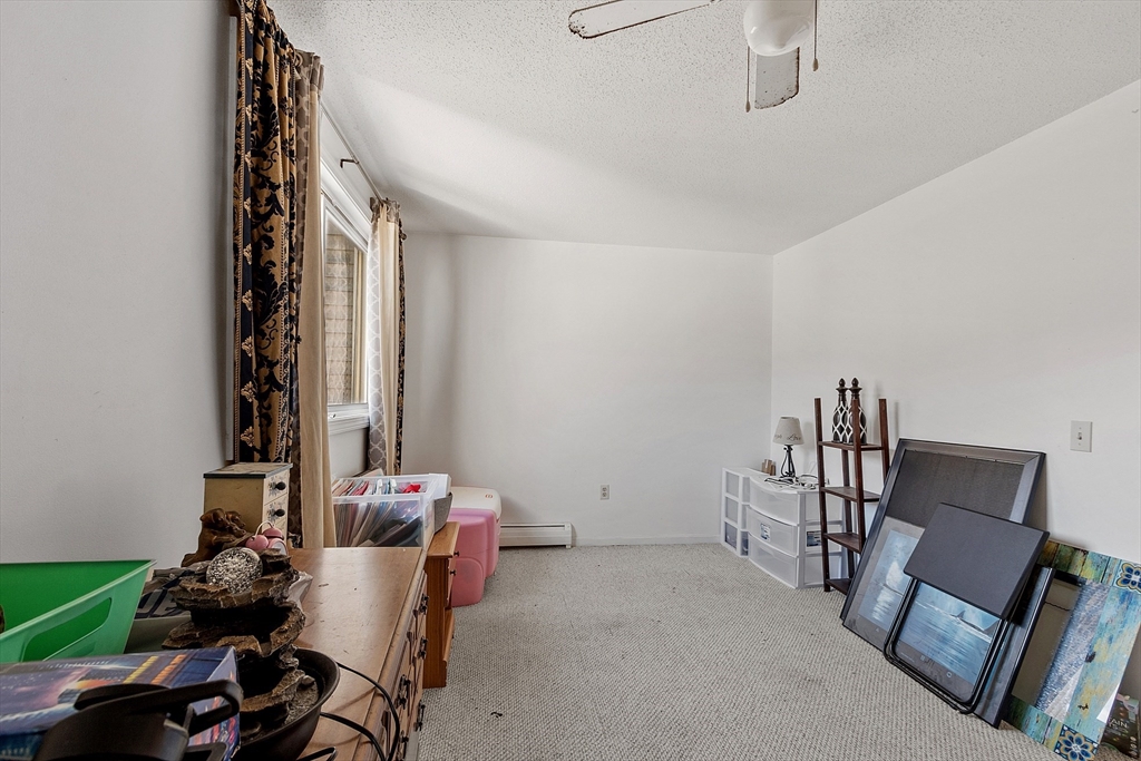 168 Ayer Road, Unit F3 Shirley, MA 01464 - Photo 21 of 36 a room with furniture and gym equipment