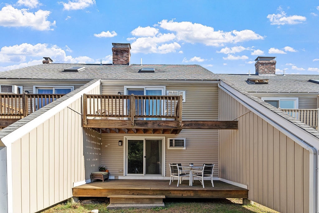 168 Ayer Road, Unit F3 Shirley, MA 01464 - Photo 26 of 36 a view of a house with a deck
