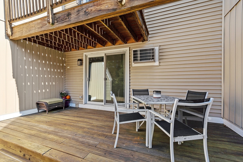 168 Ayer Road, Unit F3 Shirley, MA 01464 - Photo 28 of 36 a patio with table and chairs