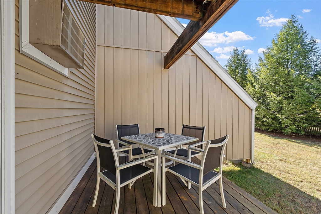 168 Ayer Road, Unit F3 Shirley, MA 01464 - Photo 29 of 36 a patio with table and chairs