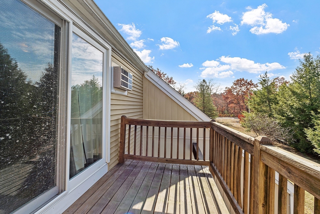 168 Ayer Road, Unit F3 Shirley, MA 01464 - Photo 30 of 36 a view of a balcony with wooden floor
