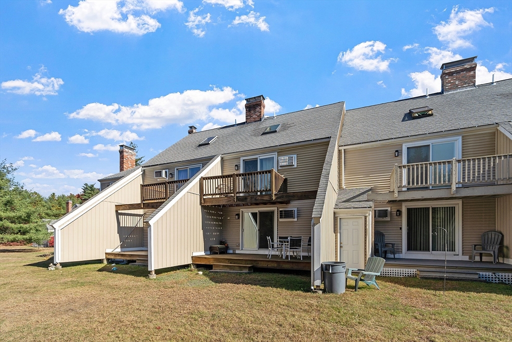 168 Ayer Road, Unit F3 Shirley, MA 01464 - Photo 33 of 36 a front view of a house with a yard