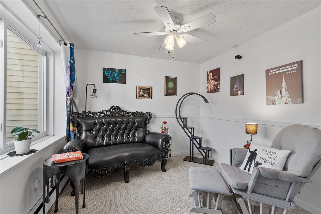 168 Ayer Road, Unit F3 Shirley, MA 01464 - Photo 5 of 36 a living room with furniture a rug and a window