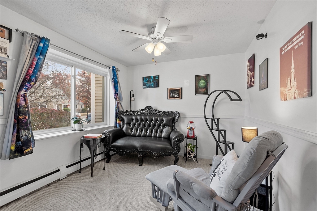168 Ayer Road, Unit F3 Shirley, MA 01464 - Photo 6 of 36 a living room with furniture and a large window