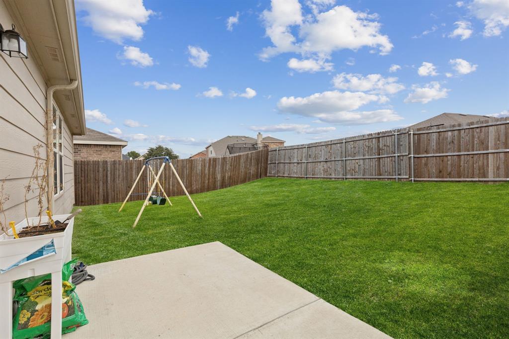 1207 Perrin Drive Forney, TX 75126 - Photo 18 of 20 a view of outdoor space yard and slide