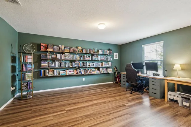 a workspace with a bookshelf