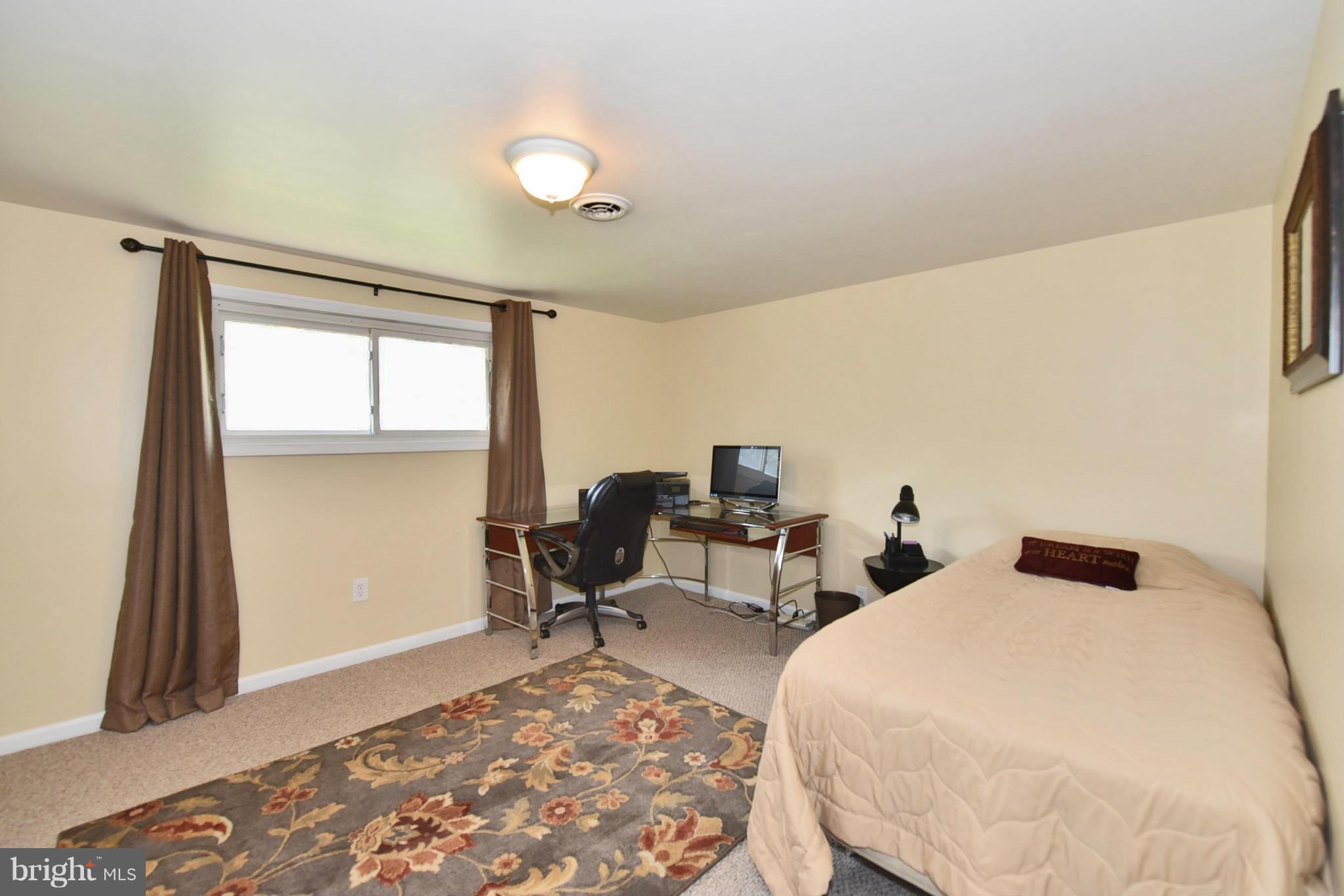 7124 Greenbank Road Baltimore, MD 21220 - Photo 16 of 30 a bedroom with a bed and a window