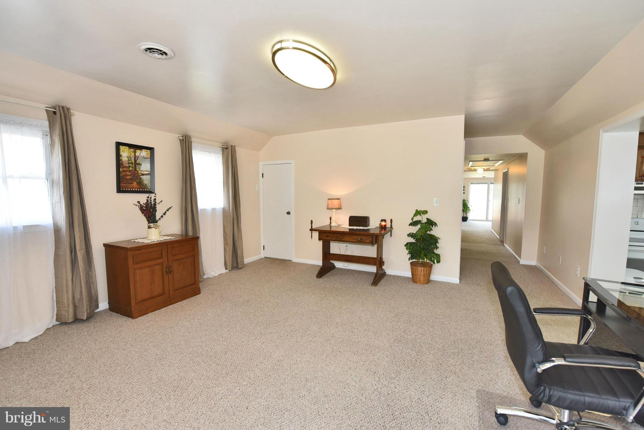 7124 Greenbank Road Baltimore, MD 21220 - Photo 18 of 30 a view of a livingroom with furniture and windows