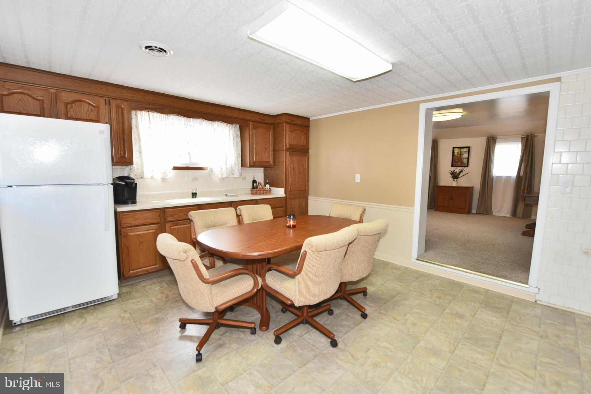 7124 Greenbank Road Baltimore, MD 21220 - Photo 22 of 30 a dining room with furniture and window