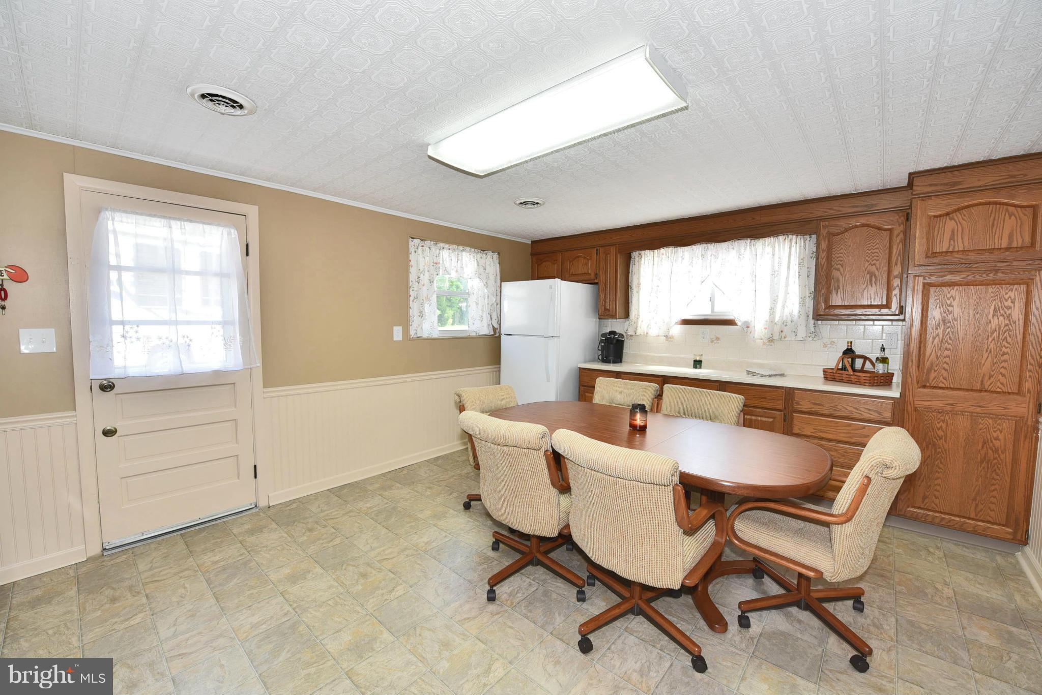 7124 Greenbank Road Baltimore, MD 21220 - Photo 23 of 30 a dining room with furniture and window