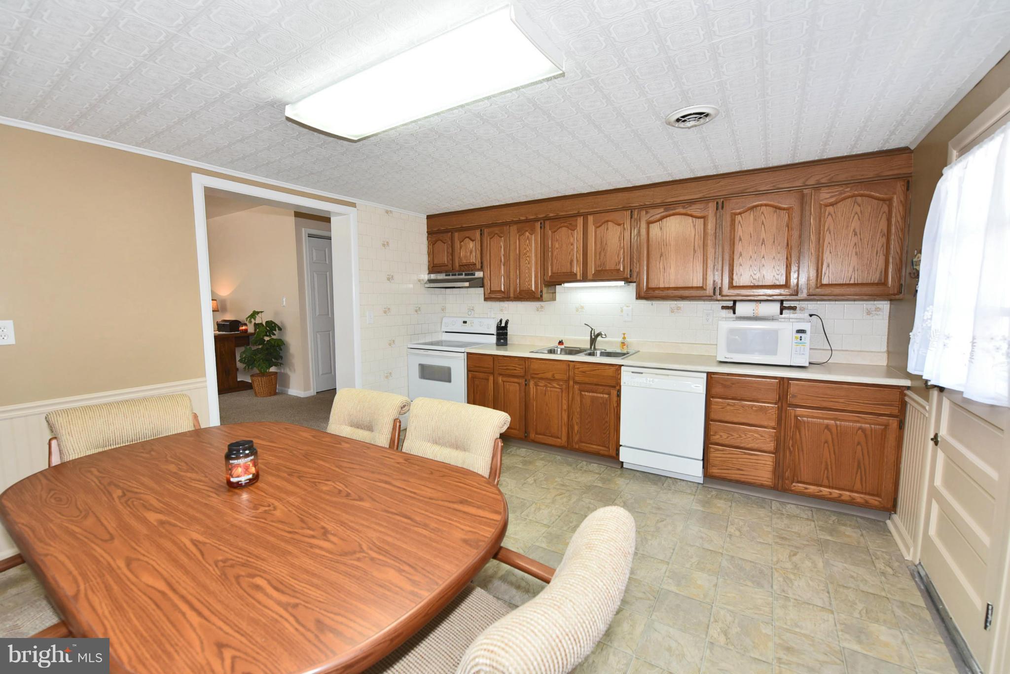 7124 Greenbank Road Baltimore, MD 21220 - Photo 25 of 30 a kitchen with a refrigerator sink and cabinets