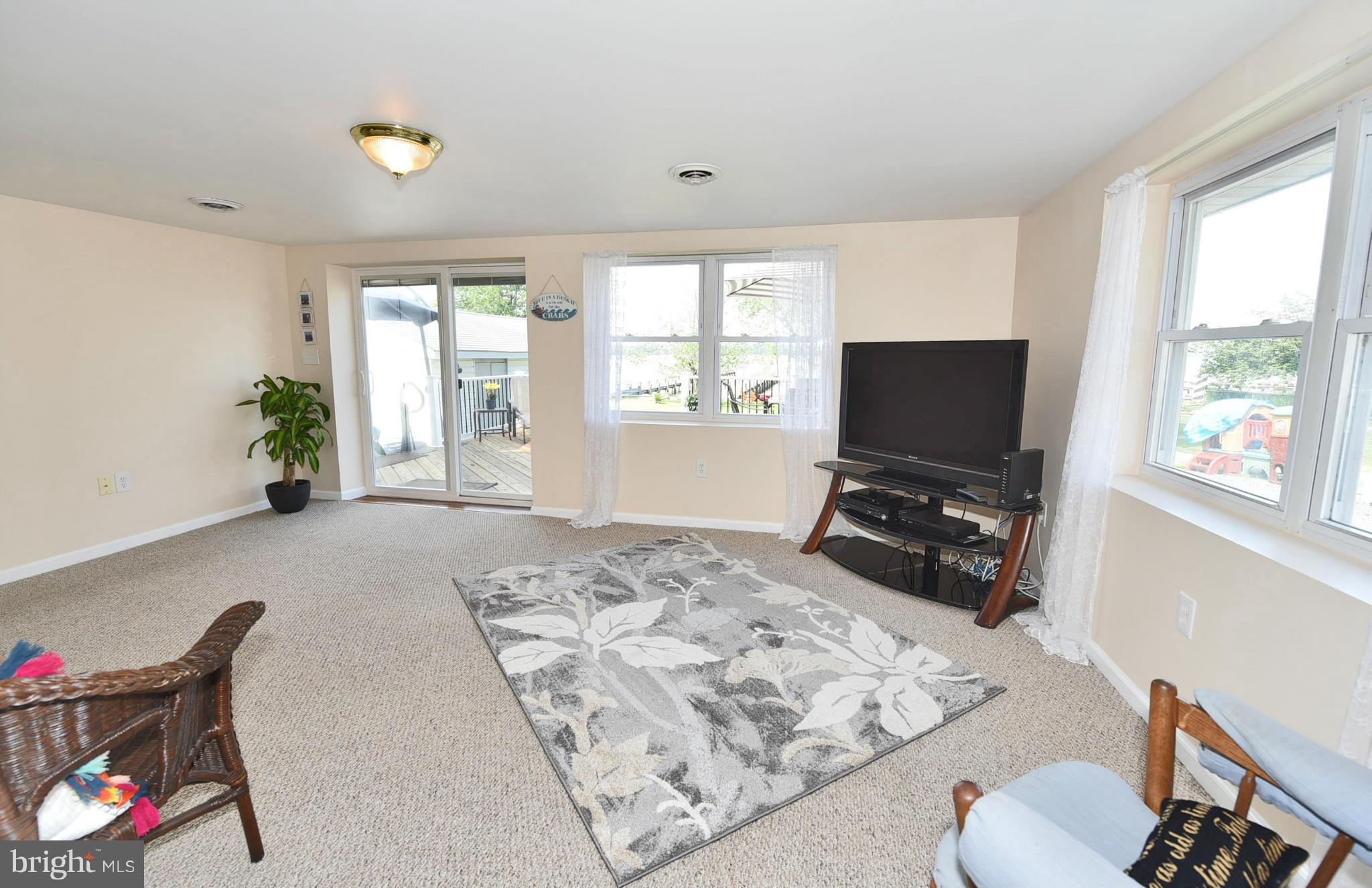 7124 Greenbank Road Baltimore, MD 21220 - Photo 9 of 30 a bedroom with furniture and a flat screen tv