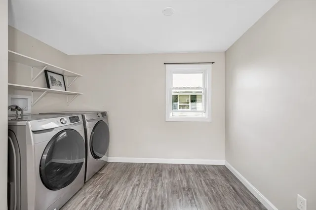 a view of a hallway with washer and dryer