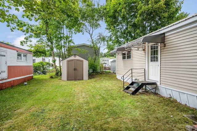 a view of a backyard with a sitting area