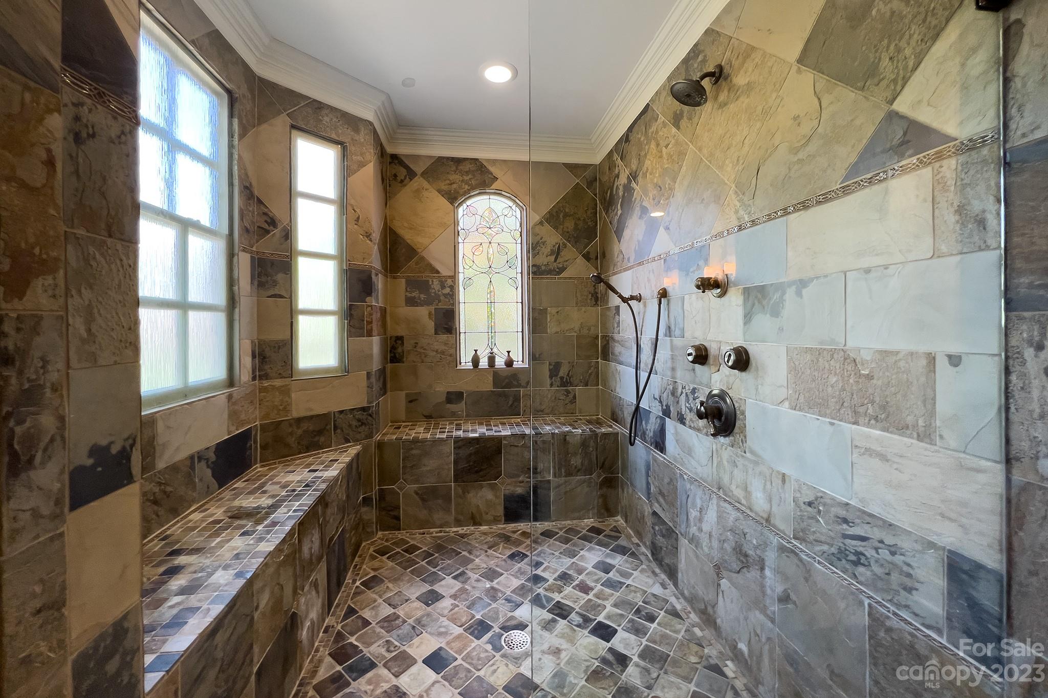 4500 Nora's Path Road Charlotte, NC 28226 - Photo 23 of 48 a bathroom with a tub a sink and a shower