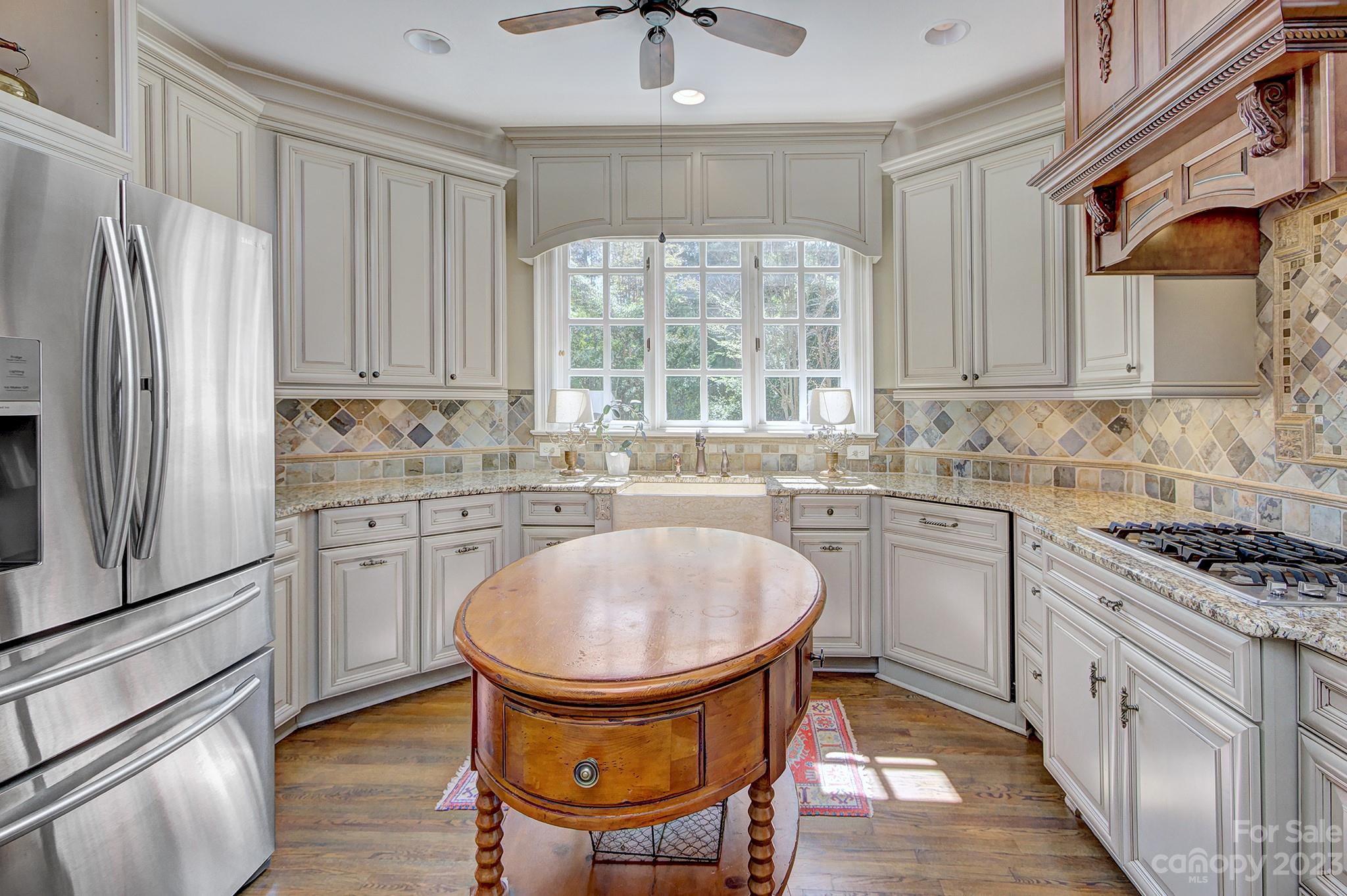 4500 Nora's Path Road Charlotte, NC 28226 - Photo 9 of 48 a kitchen with a stove a sink and a refrigerator