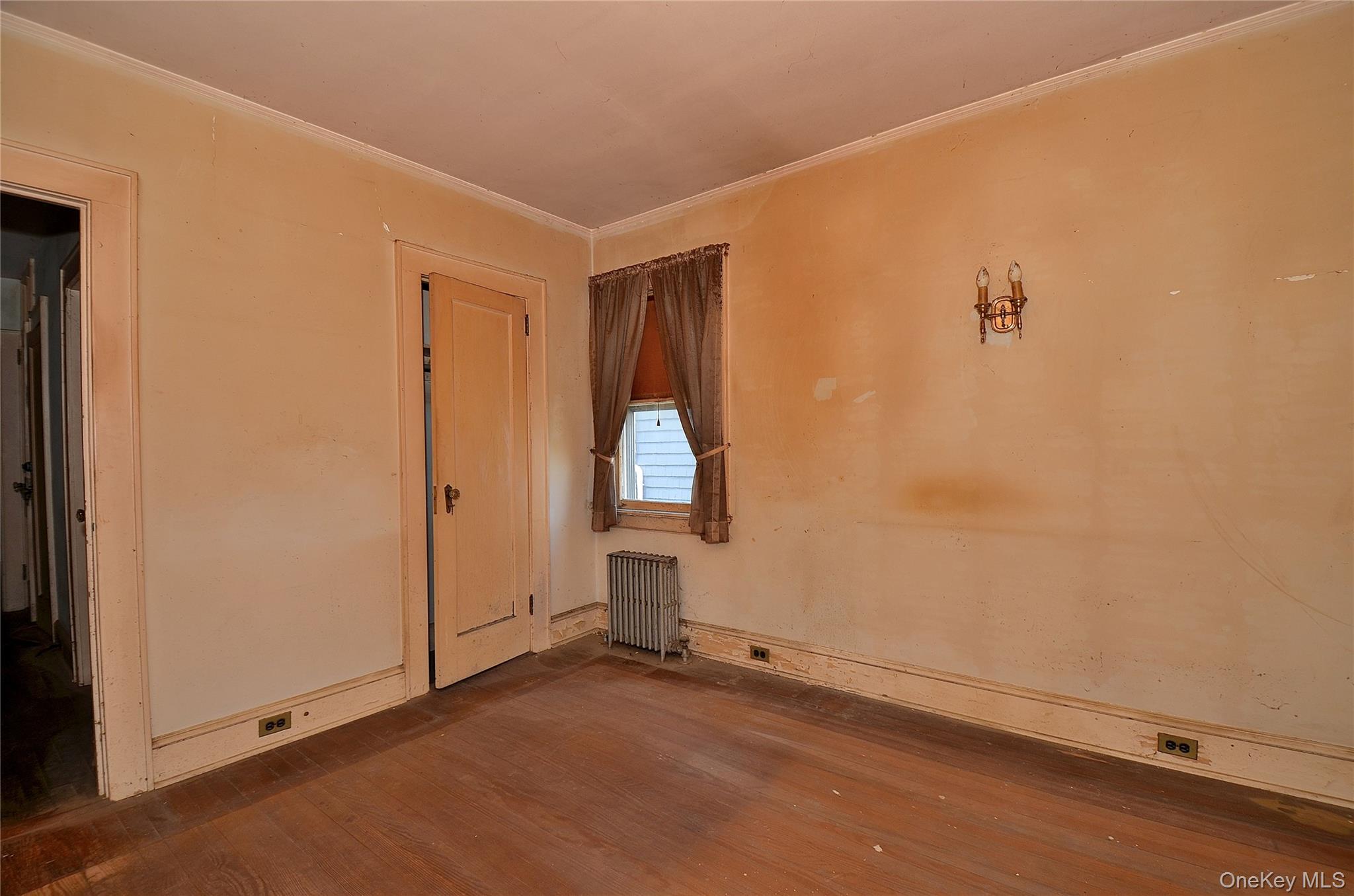 2586 Riverside Drive Wantagh, NY 11793 - Photo 14 of 28 Bedroom featuring hardwood flooring, light-toned walls, white trim