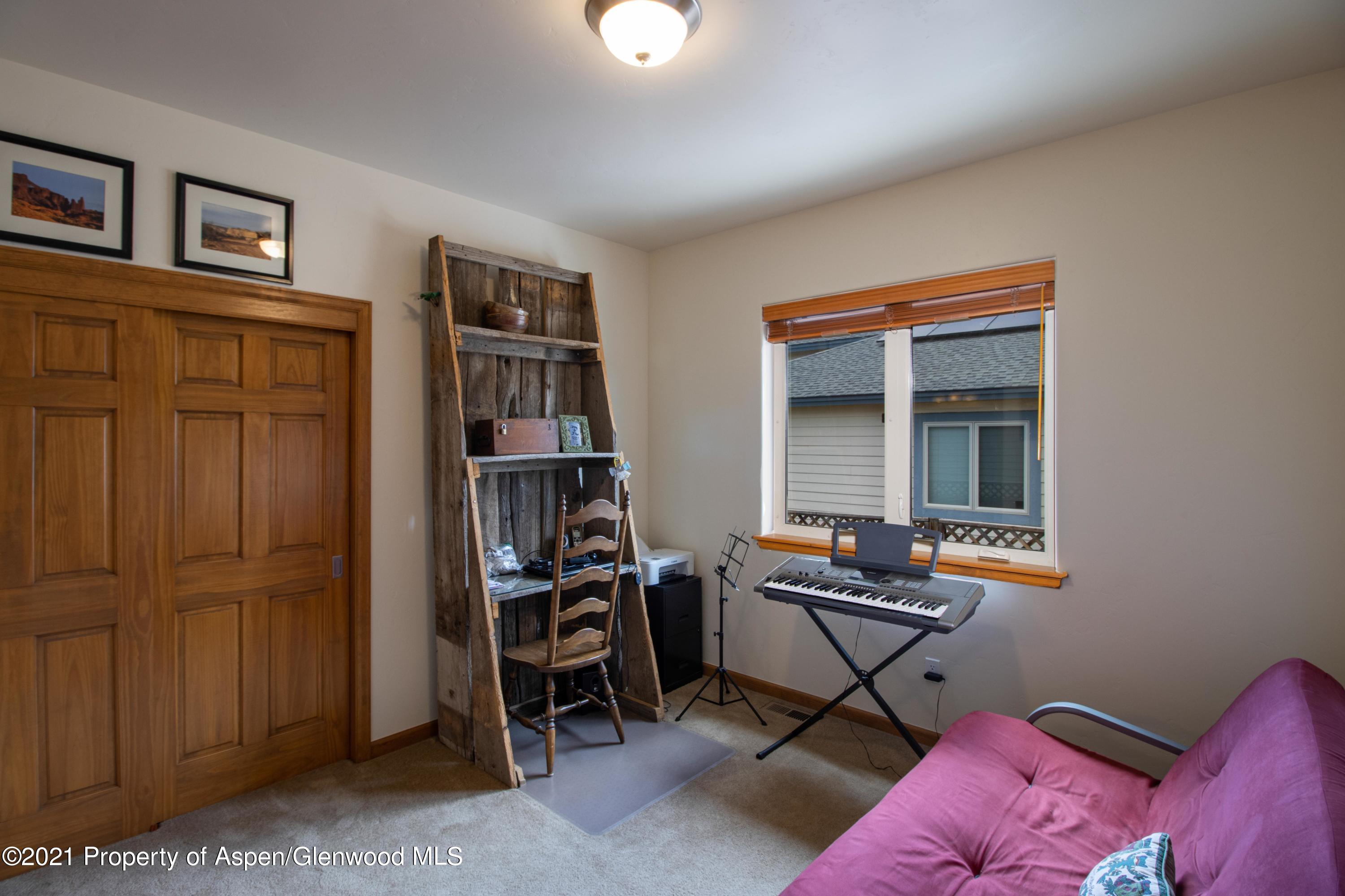1904 Promontory Circle Rifle, CO 81650 - Photo 11 of 20 a work room with furniture and book shelfs