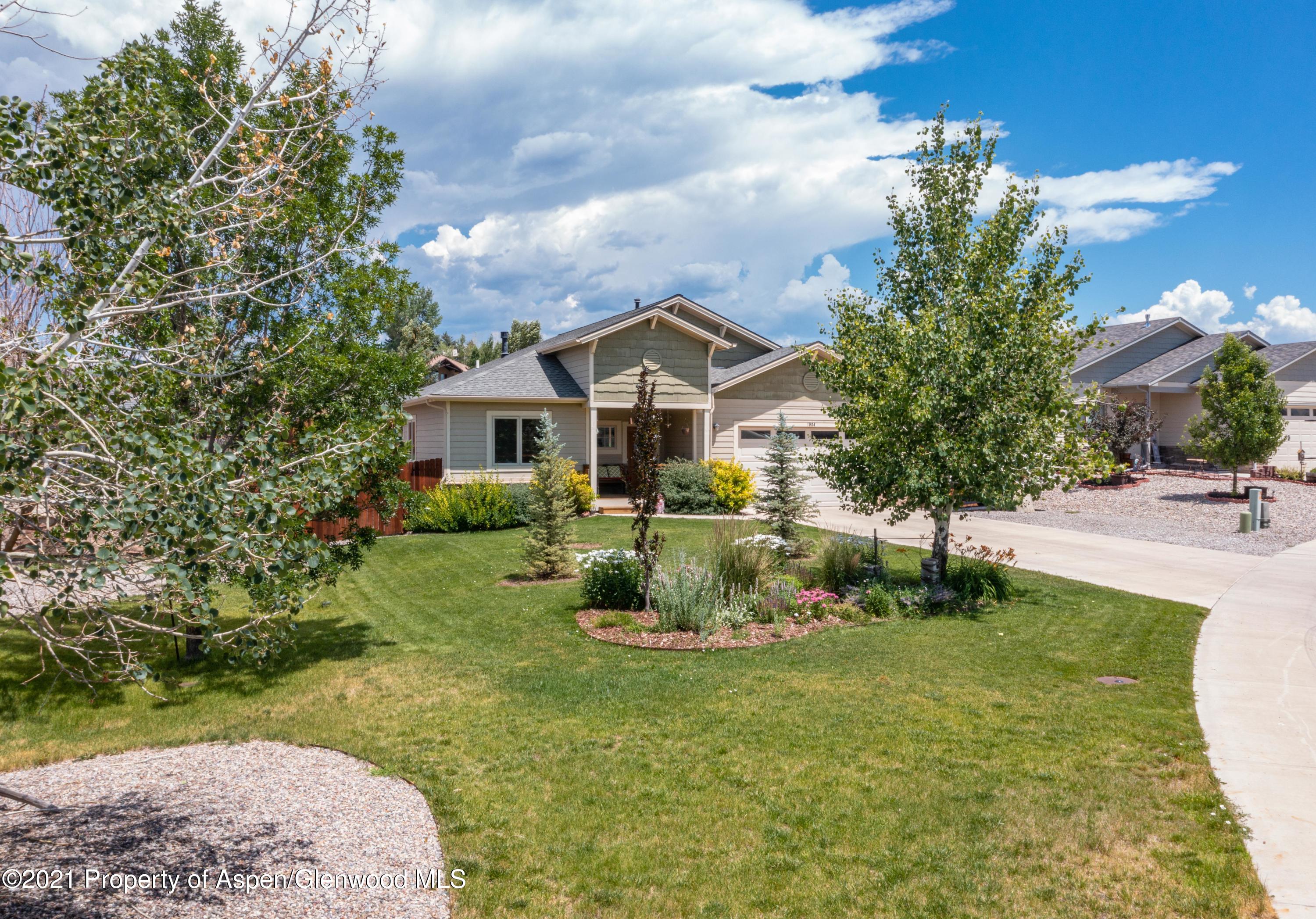 1904 Promontory Circle Rifle, CO 81650 - Photo 15 of 20 a front view of a house with garden