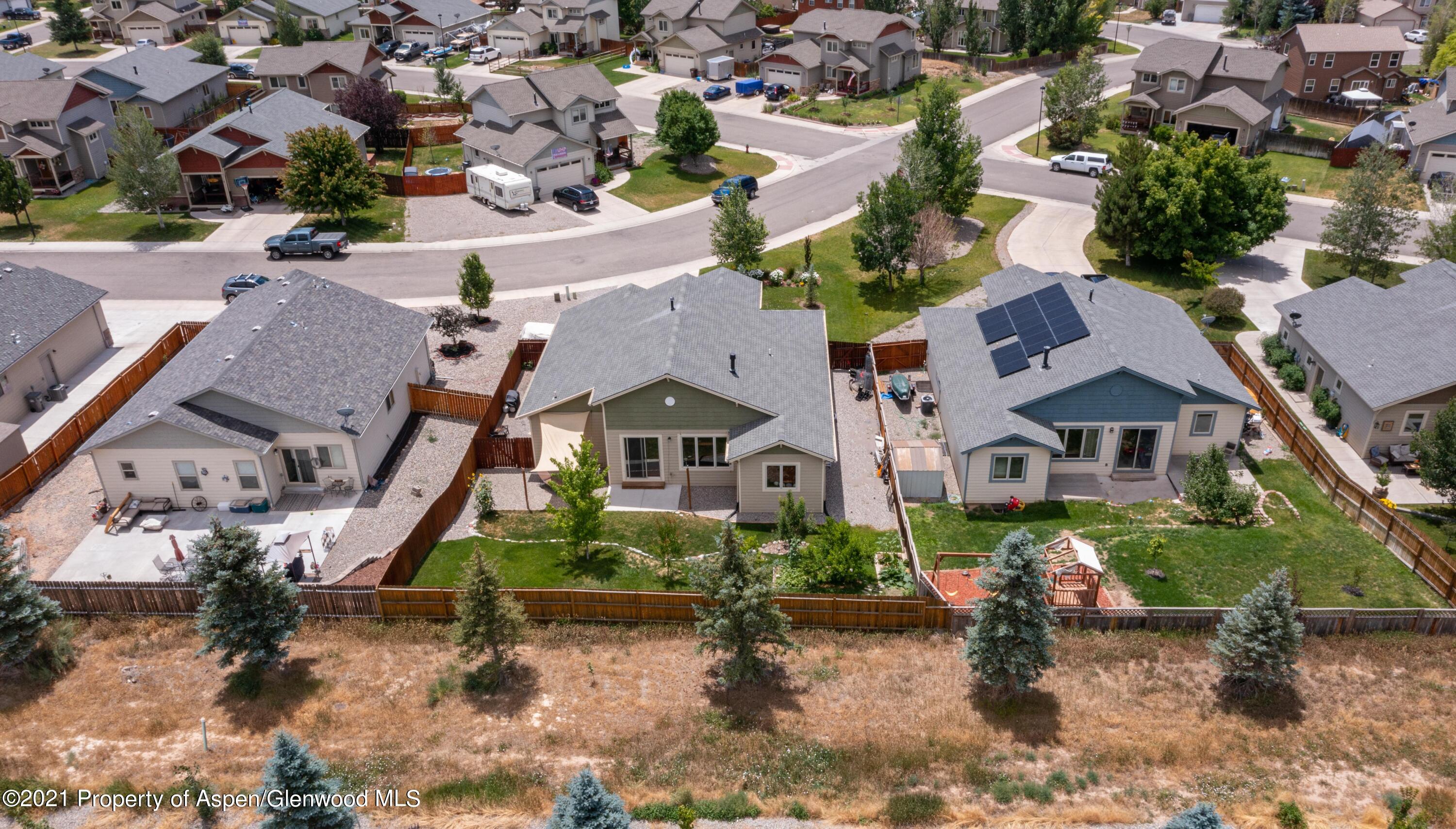1904 Promontory Circle Rifle, CO 81650 - Photo 19 of 20 an aerial view of multiple houses with a yard