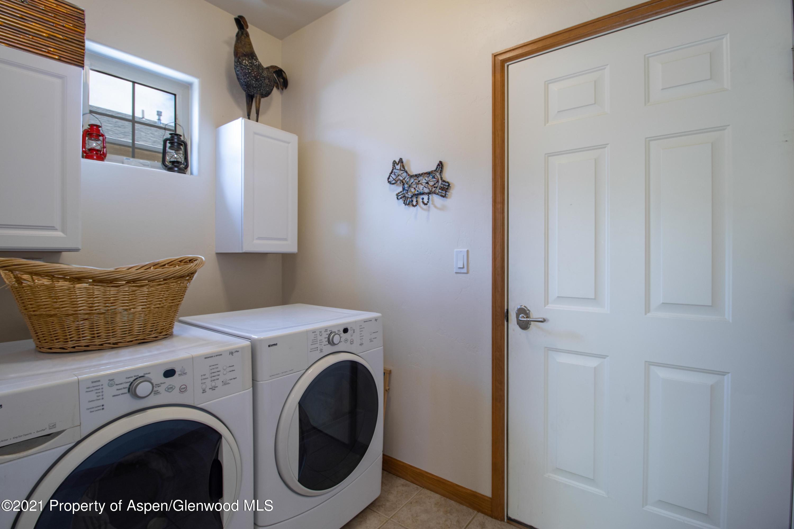 1904 Promontory Circle Rifle, CO 81650 - Photo 8 of 20 a utility room with dryer and washer