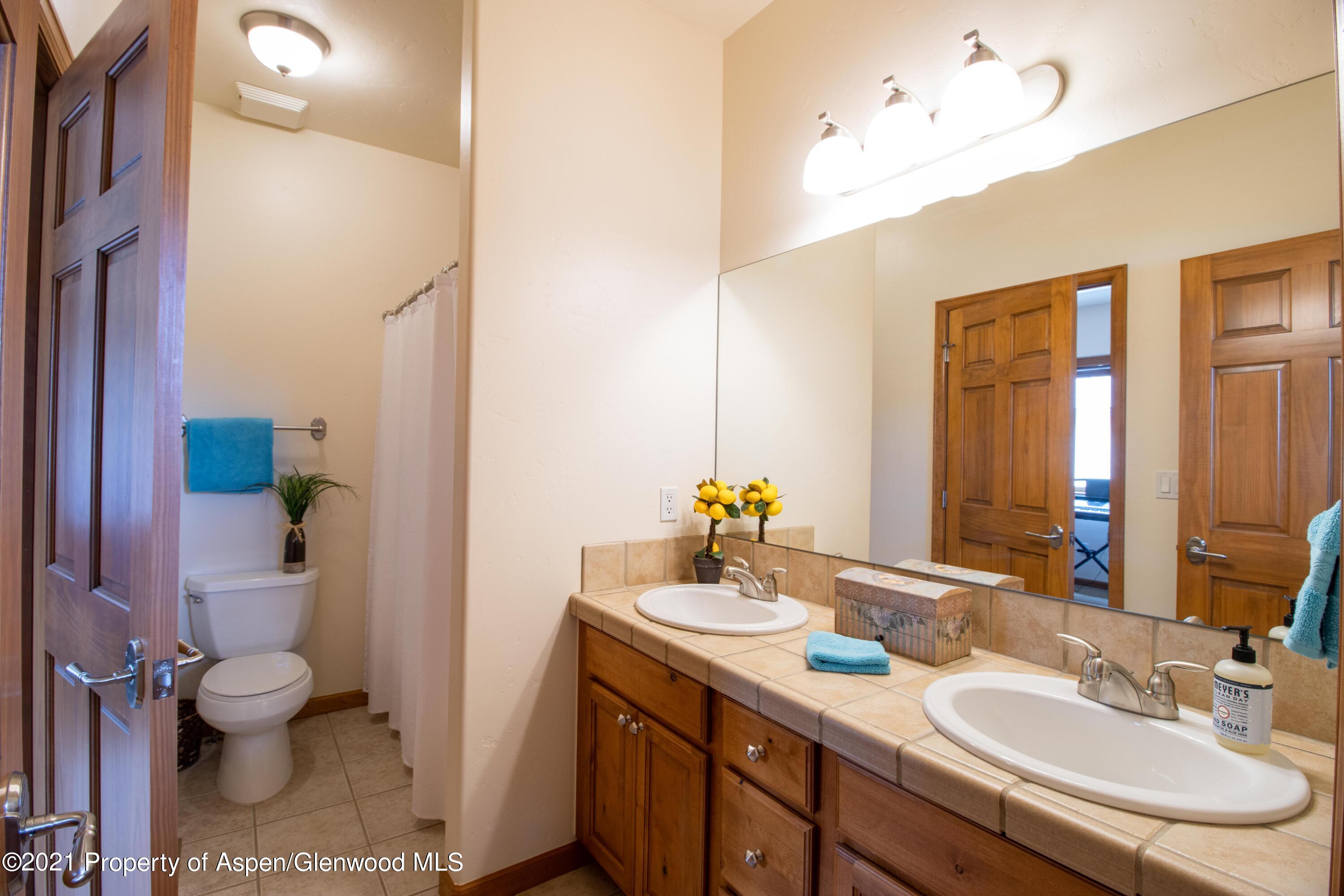 1904 Promontory Circle Rifle, CO 81650 - Photo 10 of 20 a bathroom with a sink vanity granite and toilet