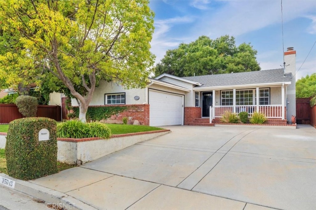 25013 Wheeler Road Newhall, CA 91321 - Photo 1 of 1 a view of a house with backyard and garden