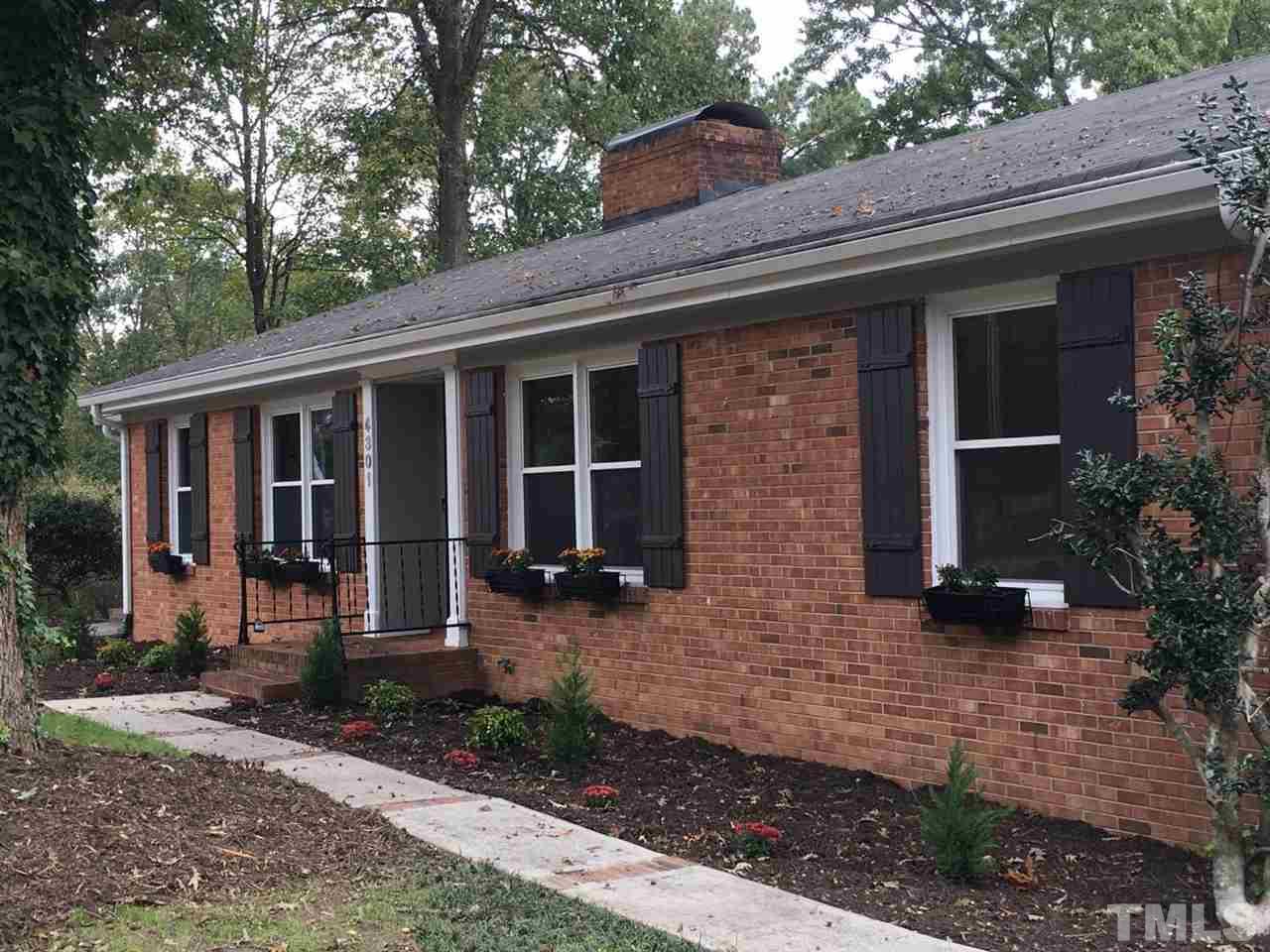 4301 Rowan Street Raleigh, NC 27609 - Photo 2 of 20 a front view of a house with garden