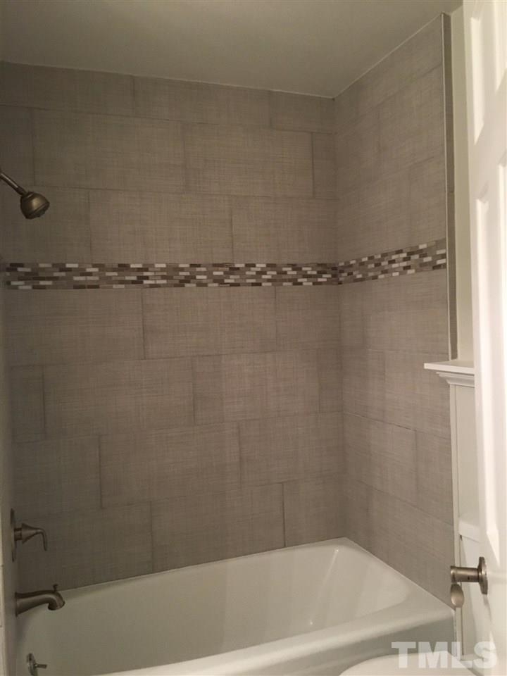 4301 Rowan Street Raleigh, NC 27609 - Photo 13 of 20 a bathroom with a bathtub