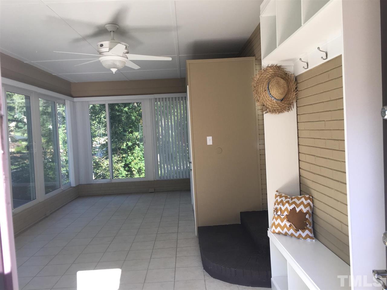 4301 Rowan Street Raleigh, NC 27609 - Photo 15 of 20 a view of livingroom with furniture and chandelier fan