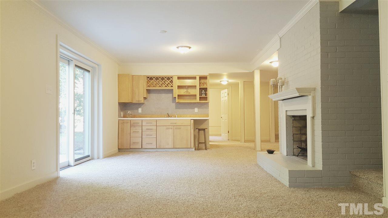 4301 Rowan Street Raleigh, NC 27609 - Photo 17 of 20 a view of a kitchen with a sink and a refrigerator