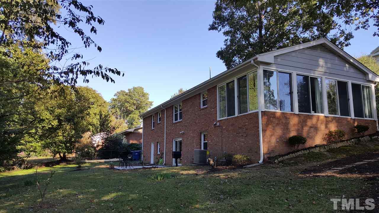 4301 Rowan Street Raleigh, NC 27609 - Photo 3 of 20 a view of a house with a yard