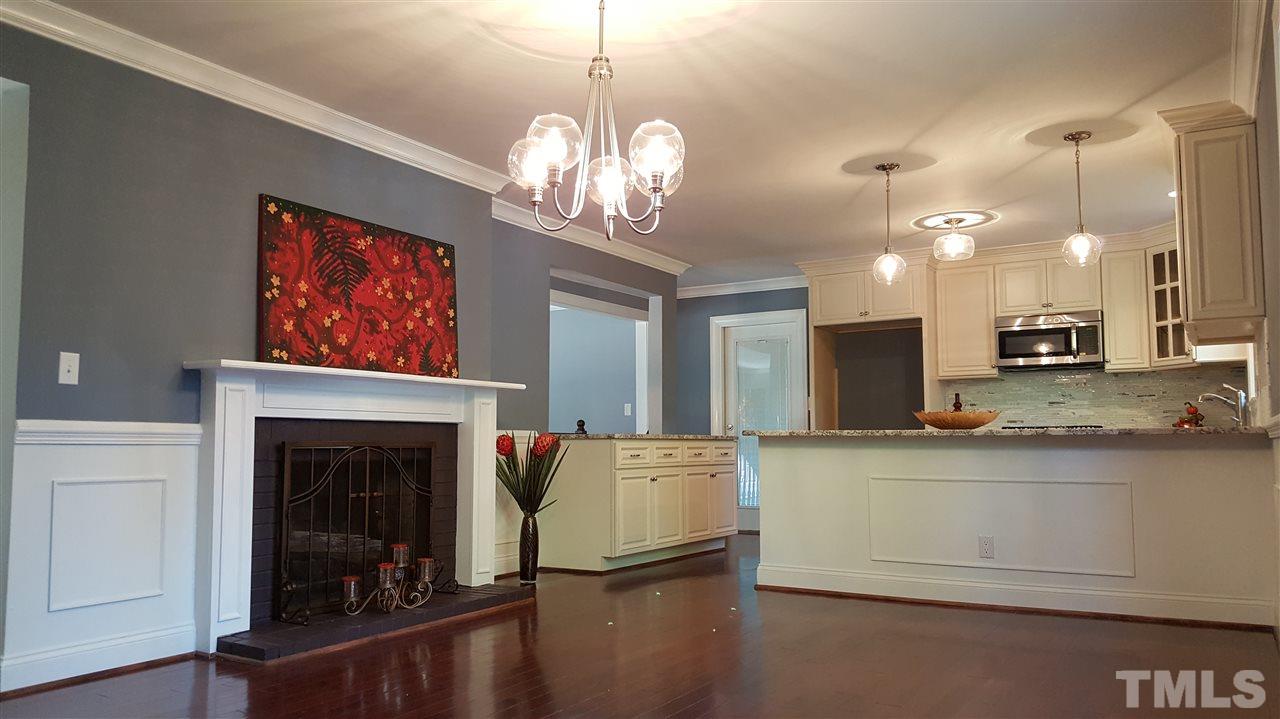 4301 Rowan Street Raleigh, NC 27609 - Photo 5 of 20 a view of a kitchen sink and a fireplace