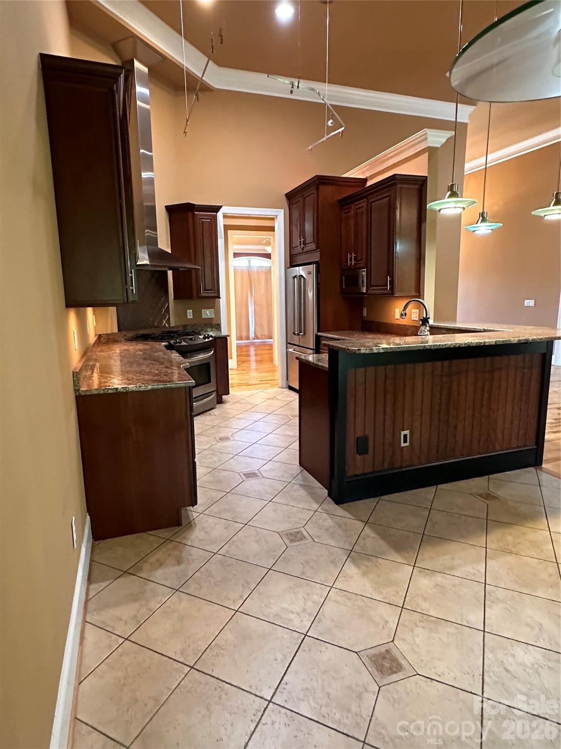 26 Stone House Road Arden, NC 28704 - Photo 8 of 21 a kitchen with stainless steel appliances a counter top space wooden floor