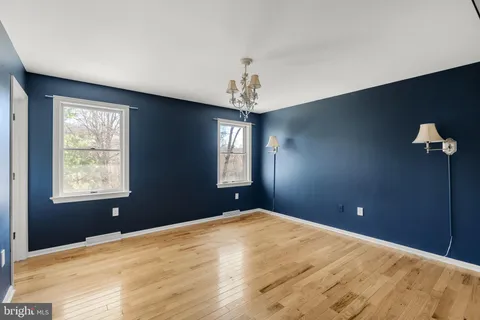 a bedroom with bed and window
