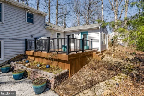 a view of a chairs and table in backyard