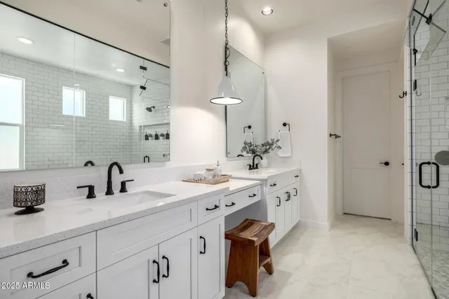 a bathroom with a bathtub and shower