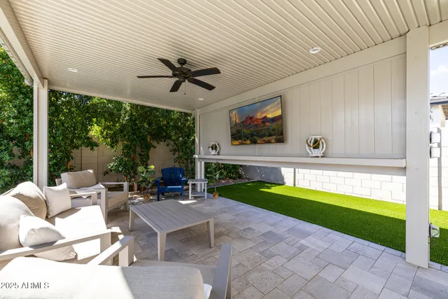 a view of a patio with a table and chairs